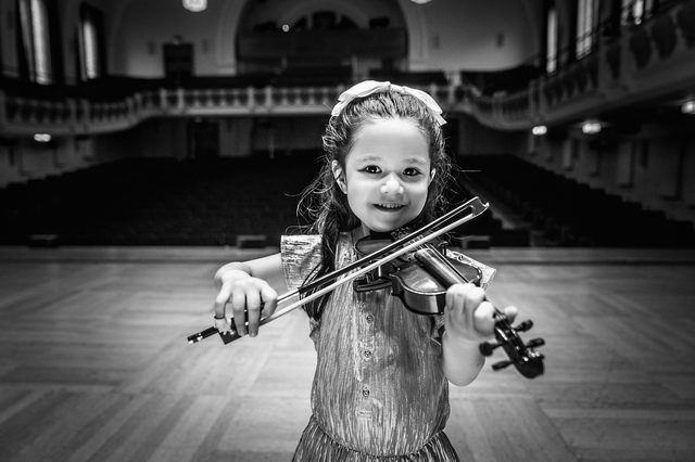 Sophie, aged four, taking a bow after a recital