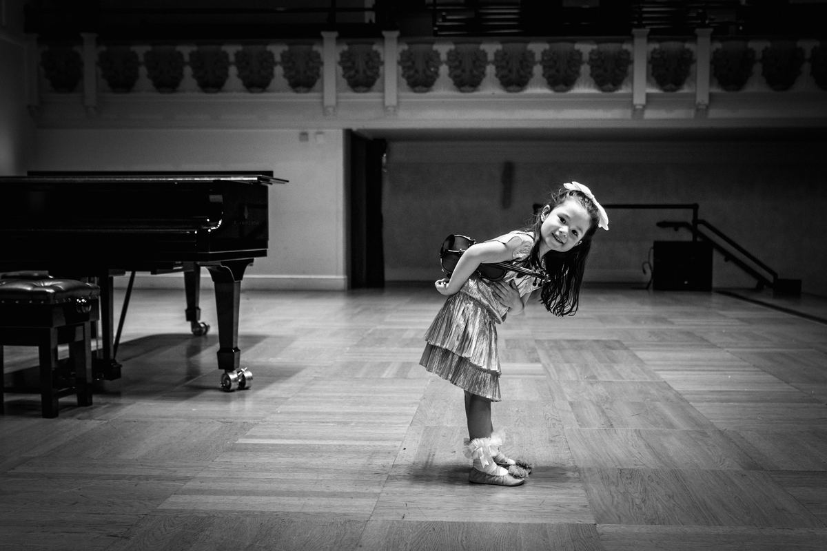 Sophie, aged four, taking a bow after a recital